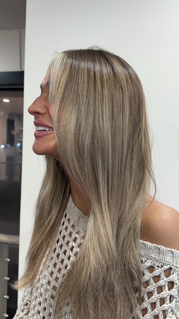 Dimensional blonde color, sleek and straight, by Evelyn